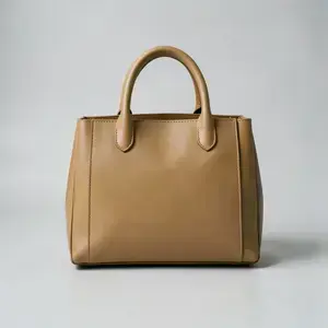 Structured leather handbag inside the glass showcase sphere
