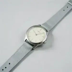 Minimal wristwatch inside the glass showcase sphere